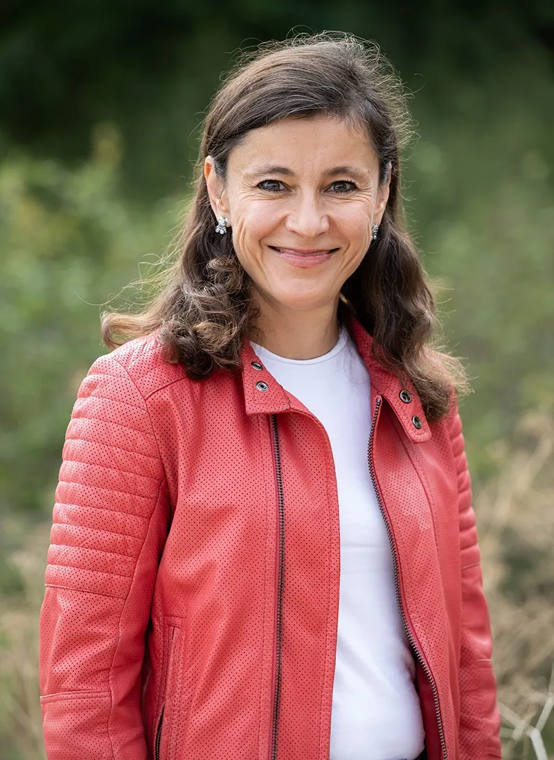 Career coach Irina Dmitrieva smiling outdoors