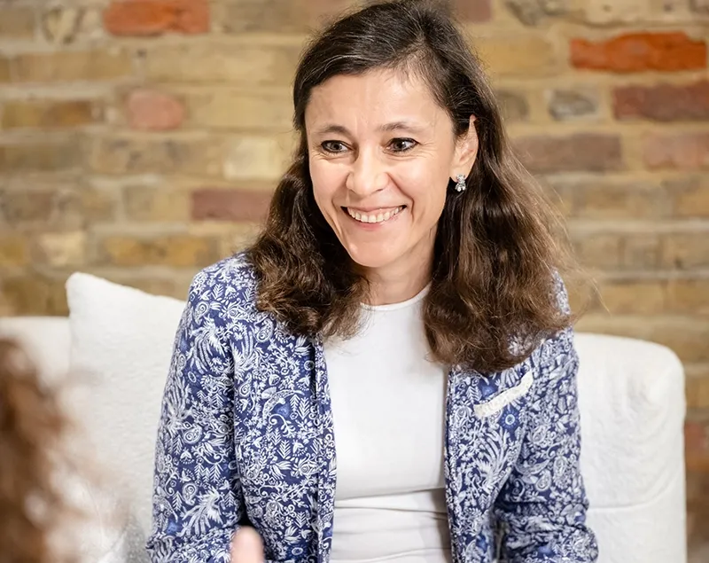 Irina Dmitrieva listening during a face-to-face coaching conversation